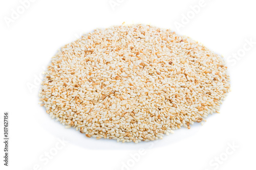 Heap of sesame seeds isolated on white background, side view.