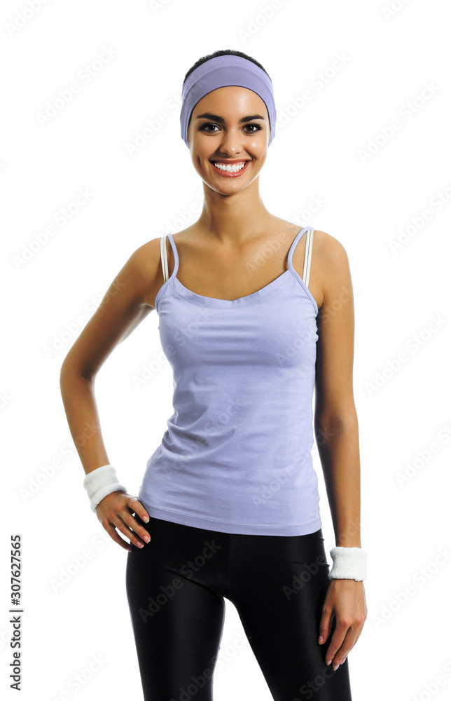 Portrait of smiling sporty african american woman in sportswear, isolated over white background. Young female fitness instructor or personal trainer at studio shot. Health, beauty and fitness concept. Portrait of smiling sporty african american woman in sportswear, isolated over white background. Young female fitness instructor or personal trainer at studio shot. Health, beauty and fitness concept.