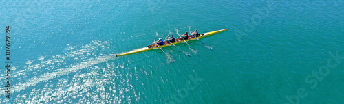 Fotografie, Tablou Aerial drone top panoramic view of sport canoe rowing synchronous athletes compe