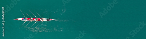 Quadro su tela Aerial drone top panoramic view of sport canoe rowing synchronous athletes compe