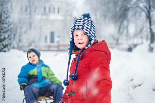 Cute kids playing in a snowy park