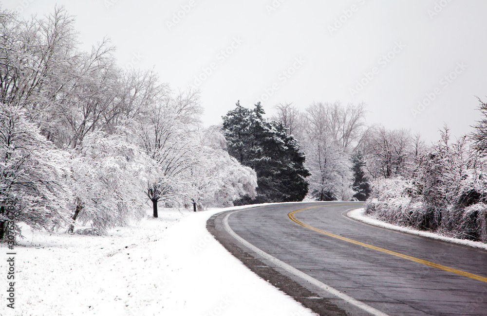Winter road through the forest Winter road through the forest