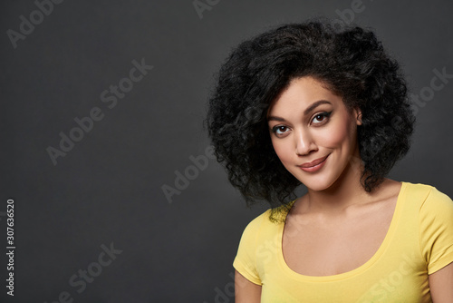 Mixed race woman looking at camera smiling
