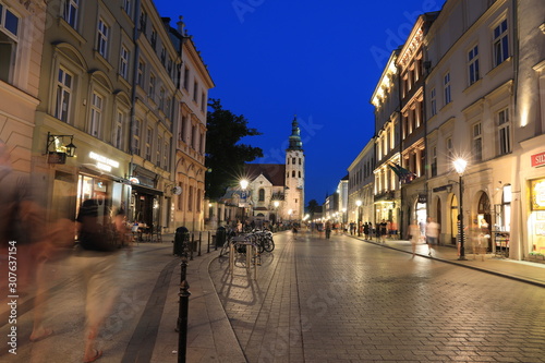KRAKOW - JUN 15:Classic street nigjt life in Krakow 15 June 2019, Poland. Krakow is one of the most populated metropolitanareas in Europe