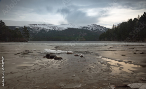 Looking over a Scottish Loch towards the Cairngorm Mountains in the Winter, Scotland, UK