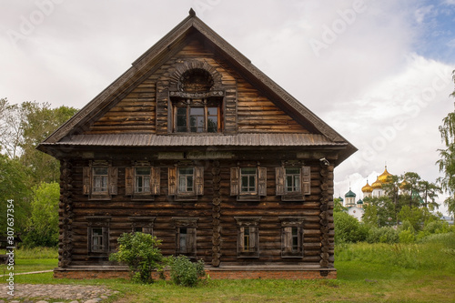 Rural landscape. The old wooden house is surrounded by birches. Kostroma, Russia.Rural landscape. The old wooden house is surrounded by birches. Kostroma, Russia.