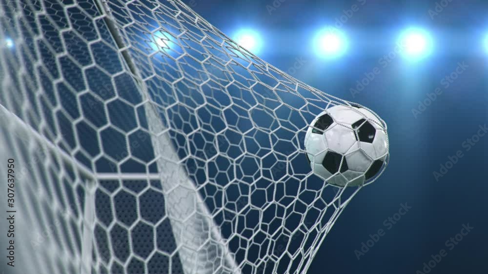 Soccer ball flies beautifully into the goal in slow motion. Soccer ball