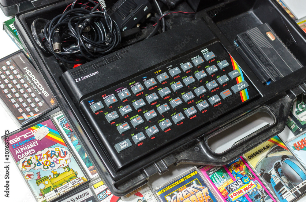 london, eng;and, 05/05/2019 A retro vintage nostalgic sinclair zx spectrum  48k 1980s computer console with games and retro joystick controllers on a  white background. Stock-Foto | Adobe Stock