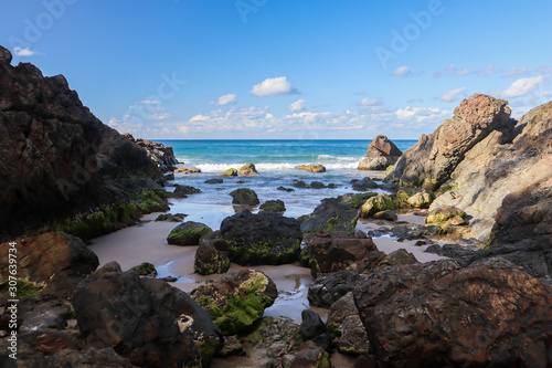 Remote cove with several rocks and the ocean in the background © Alberto