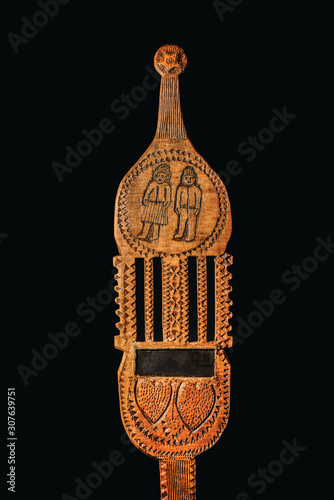Foto Wooden Distaff on black background