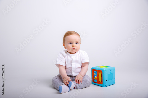 toddler with toy isolated on white background