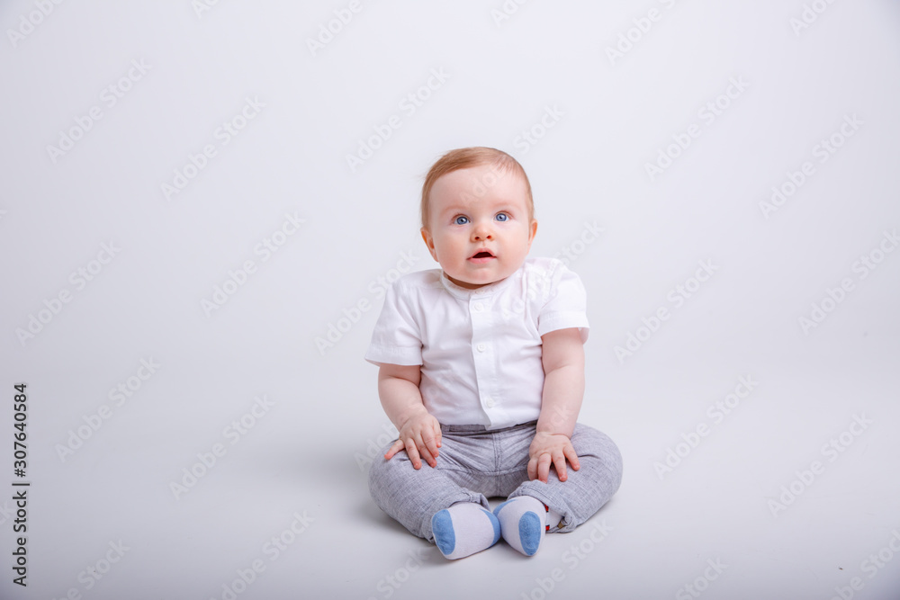 portrait of child smiling isolated on white background. baby boy sitting on a white background portrait of child smiling isolated on white background. baby boy sitting on a white background