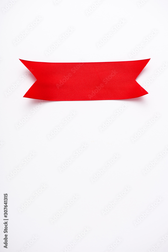 top view of red satin ribbon on white with copy space top view of red satin ribbon on white with copy space