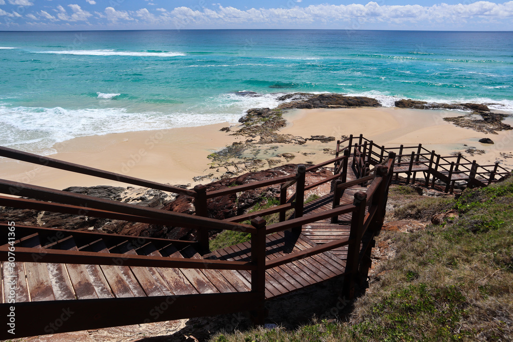 Empty beach on a summer day down the stairs Empty beach on a summer day down the stairs