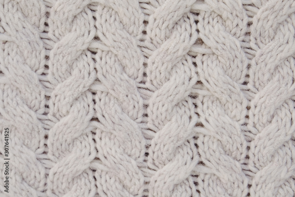 Beautiful beige knitted texture for background. White winter backdrop. Space for text. Beautiful beige knitted texture for background. White winter backdrop. Space for text.