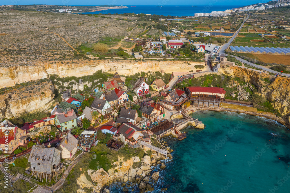 Top view of famous tourist attraction Popeye village, also known as Sweethaven village. Sunny day, blue sea. Mellieha city. Malta island