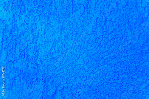 Rough texture of abstract decorative dark classic blue background of plaster wall. color 2020