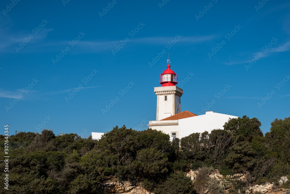 Alfanzina Lighthouse at southern coast of Portugal, Algarve, Portugal