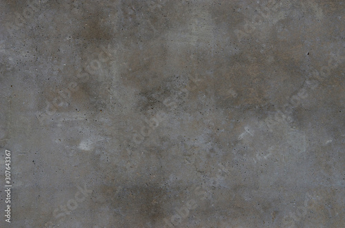 Abstract background. Smooth concrete wall with spots of various shades of gray. Structure, background.