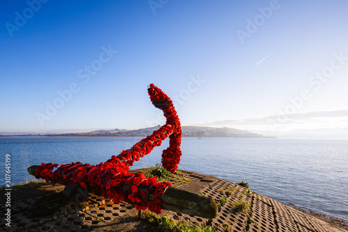 A ships anchor clad in Poppies for Remembrance Day at Appledore in North Devon
