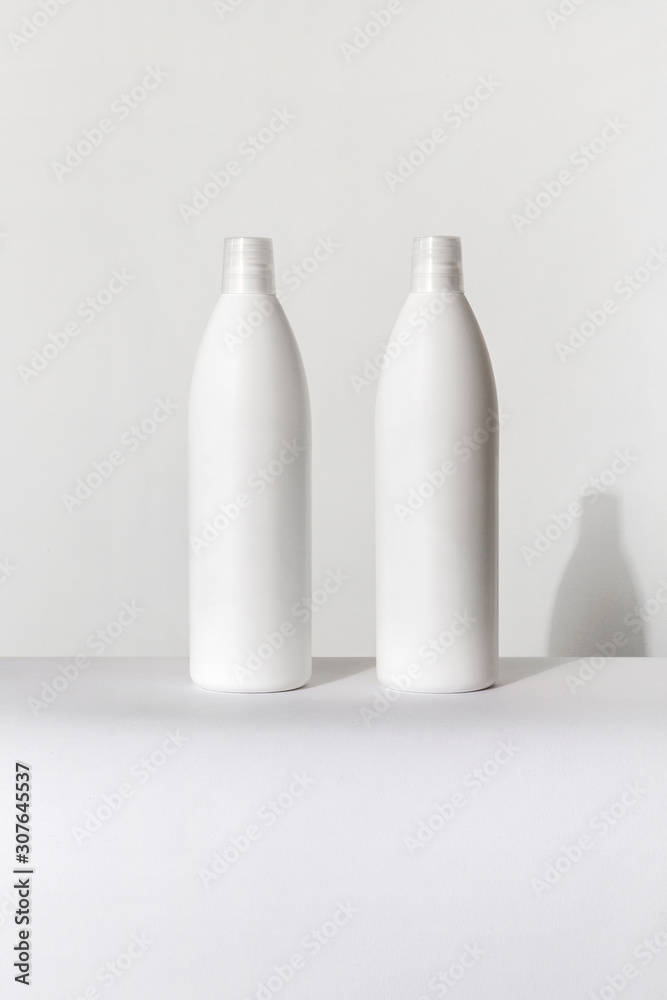 two big white bottles for cosmetics two big white bottles for cosmetics