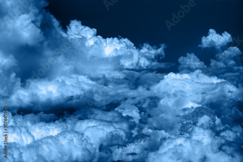 Cloudy sky background toned in blue.