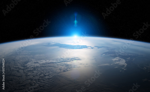 Fototapeta Naklejka Na Ścianę i Meble -  View of planet Earth close up with atmosphere during a sunrise 3D rendering elements of this image furnished by NASA
