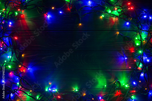 Christmas background with lights and free text space. Christmas lights. Glowing colorful Christmas lights . New Year. Garland.