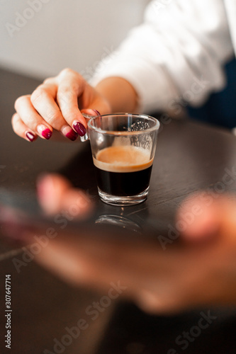 Girl drinking a coffe with phone
