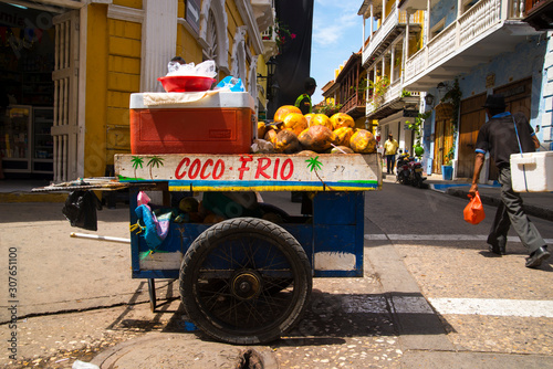 coconut street seller in Cartagena, Colombia photo