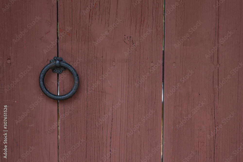 Brown door with an antique handle. Brown door with an antique handle.