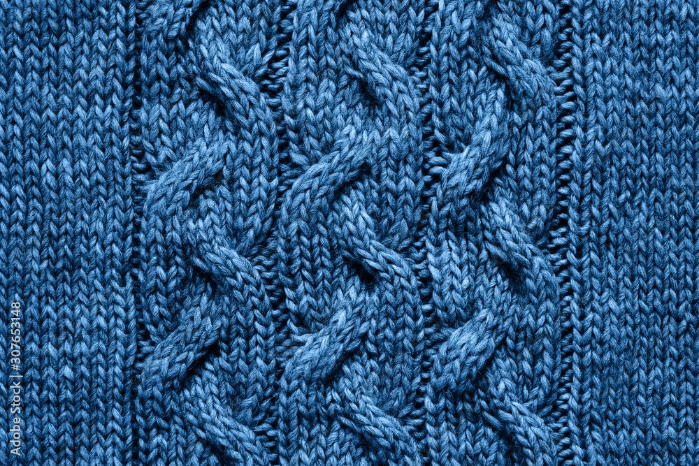 Blue knitted texture. Handmade Knitwear. Background