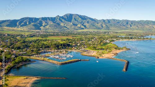Stunning aerial shot of Hawaiian town and mountain behind photo