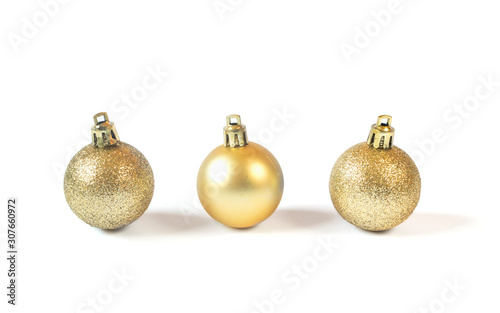 Golden baubles isolated on white background