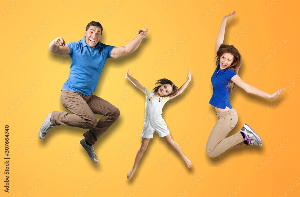Full length body size portrait of nice lovely adorable attractive positive cheerful people dad daddy mom mommy spending spare free time isolated over shine vivid pastel yellow background Full length body size portrait of nice lovely adorable attractive positive cheerful people dad daddy mom mommy spending spare free time isolated over shine vivid pastel yellow background