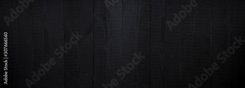 Dark wooden background, black old wood texture © daphnusia