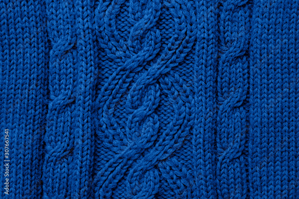 Blue knitted texture background. Trendy color 2020 concept. Copy space for text and design.