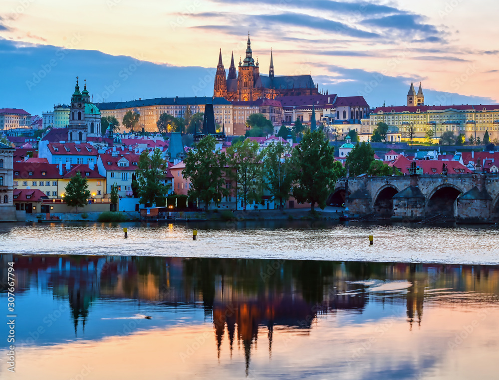 A view of Prague Castle and the Charles Bridge across the Vltava River in Prague, Czech Republic.