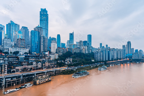  Hongya Cave  and skyline along Jialing River in Chongqing, China photo