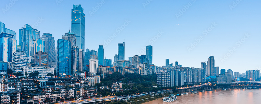 Fototapeta premium Hongya Cave and skyline along Jialing River in Chongqing, China