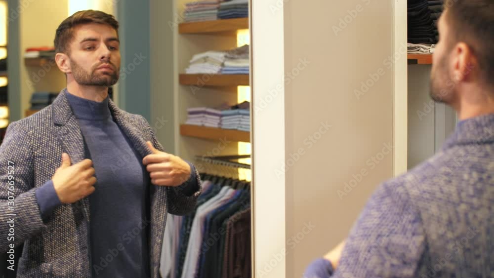 Man wearing clothes at boutique Man wearing clothes at boutique