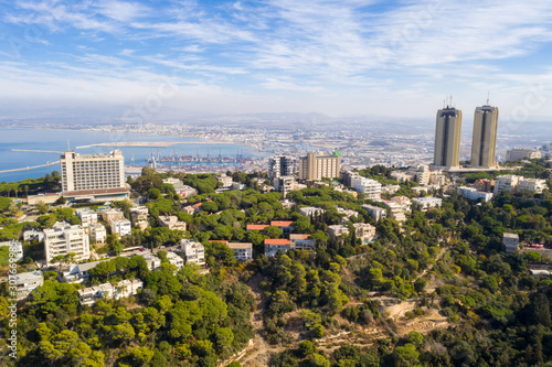 Aerial image of Haifa, Israel, showing houses on central Carmel area with Haifa bay in the background.