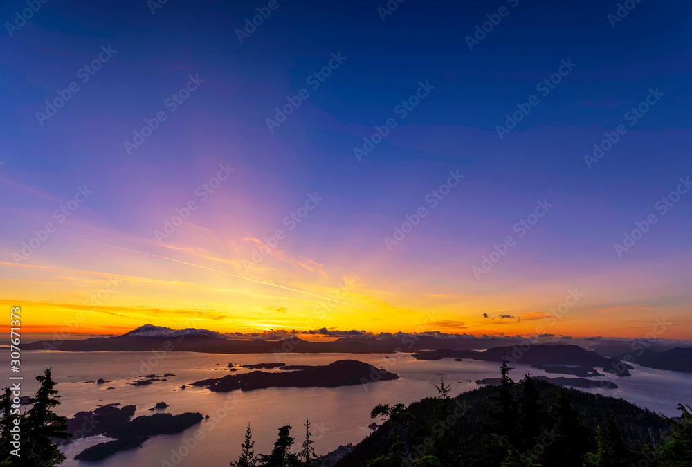 Sunset over Ocean, Islands, Silhouetted Mountains 