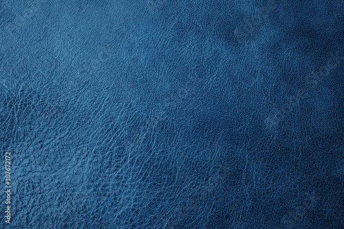 leather texture background toned in classic blue, genuine leather. Color of the year 2020. Colorful concept. Top view
