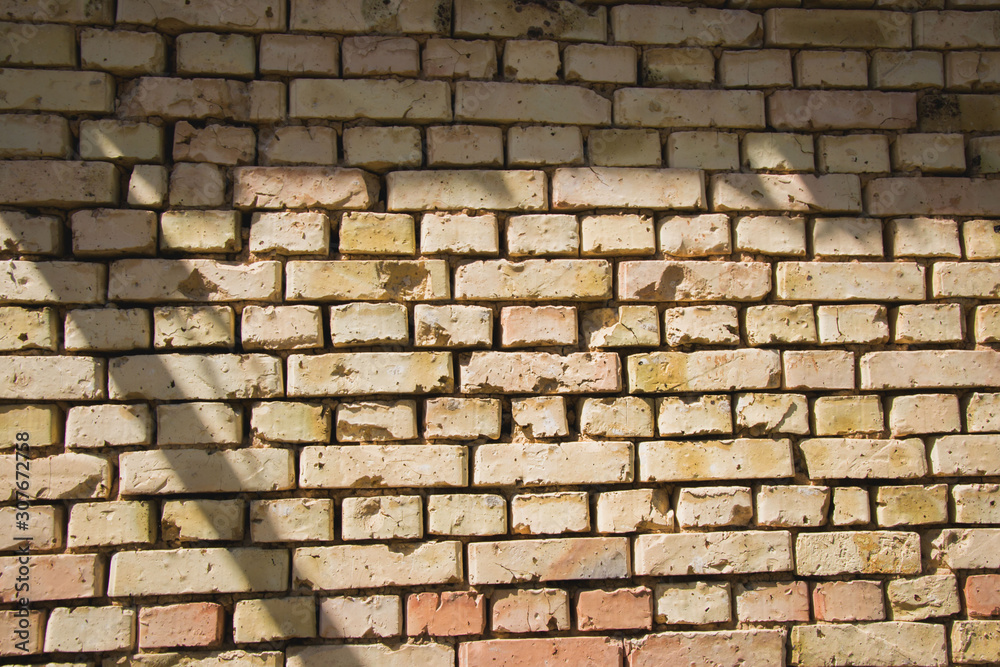 Fototapeta premium Old brick wall texture with scratches and cracks, vintage grunge background