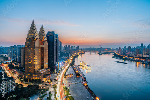Night view of golden high-rise buildings along the Yangtze River in Chongqing, China