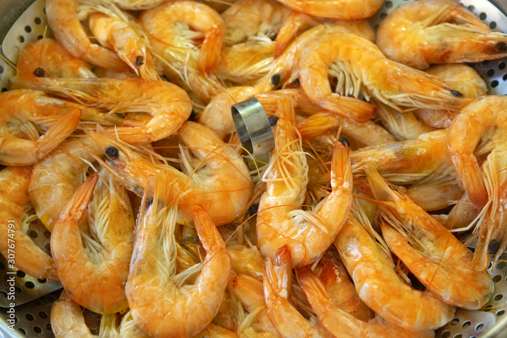 preparing little prawns in a steamer preparing little prawns in a steamer