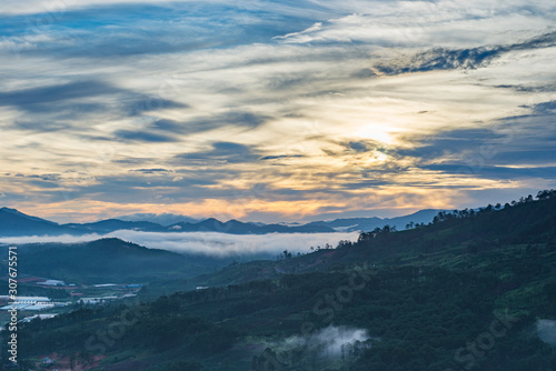 Beautiful overcast twilight sky and foggy valley in Da Lat