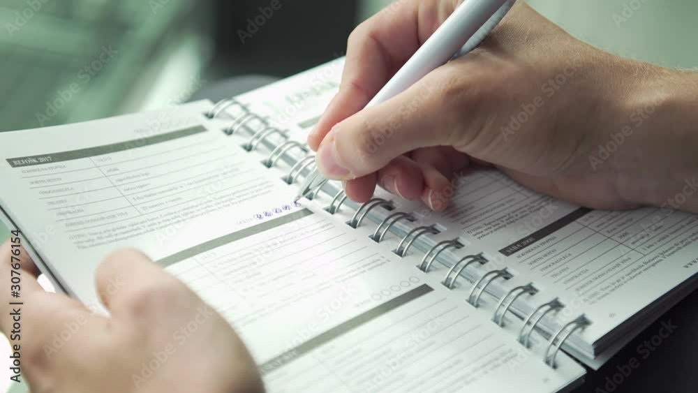 Close up shot, hand testing doing examination test with standardized test form and answers bubbled, filling out answers. Close up shot, hand testing doing examination test with standardized test form and answers bubbled, filling out answers.