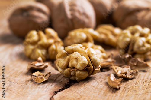 Still life with nuts on natural wood.
